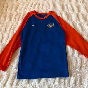 This is a university of florida, youth small, long sleeve, dry fit Nike shirt.